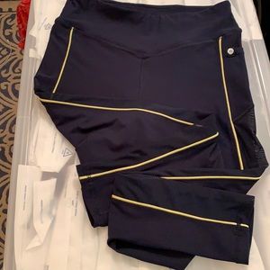 Navy and yellow yoga pants with mesh stripes